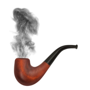 smoking pipe with gray smoke on the white background