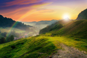 hillside near the village in morning mist