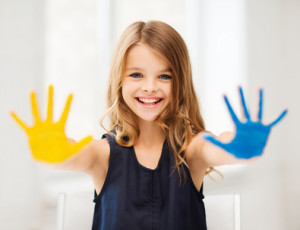 girl showing painted hands